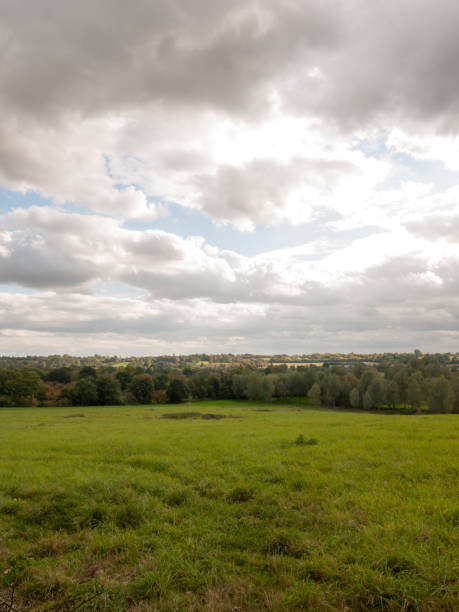 istock stormy clouds overcast autumn day sunlight over open field with trees 856783506