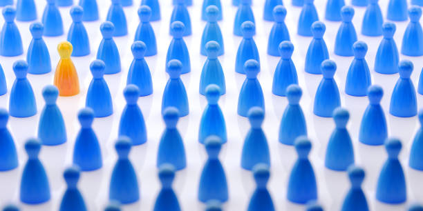 istock Yellow Pawn Surrounded by Blue pawns  Standing Out From The Crowd 856787360