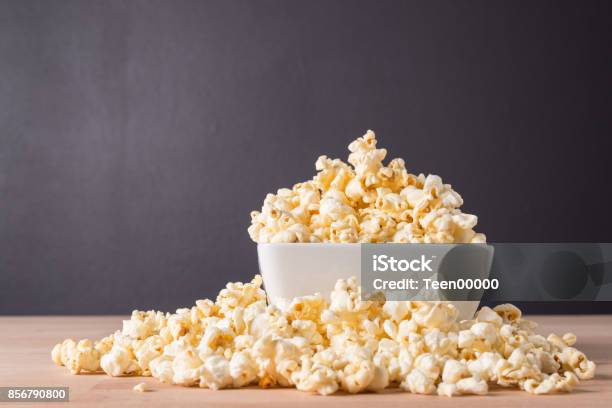 Popcorn In White Bowl On Wood Background Stock Photo - Download Image Now - Popcorn, Bowl, Gourmet