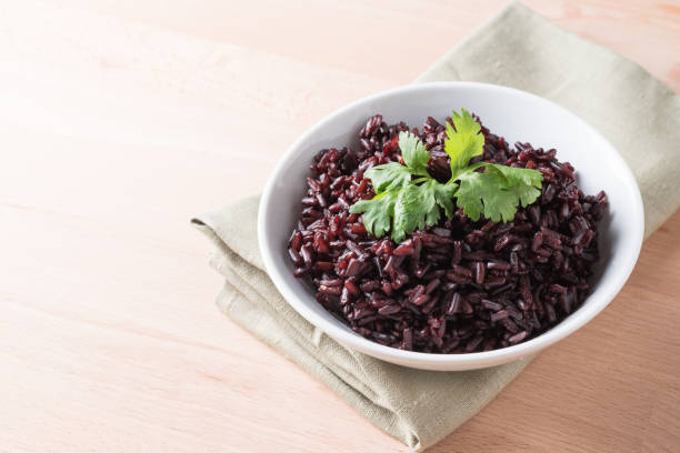 istock Steamed rice on white bowl wood background 856790816