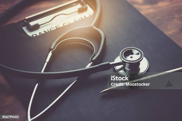 Health Insurance Claim Form With Stethoscope On Wood Table Selective Focus Stock Photo - Download Image Now