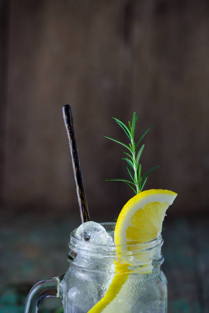istock Lemonade with fresh lemon and rosemary in glass 856791742