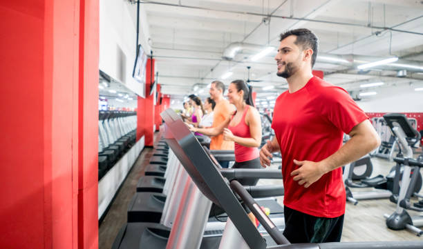 istock People at the gym running on the treadmills 856794516