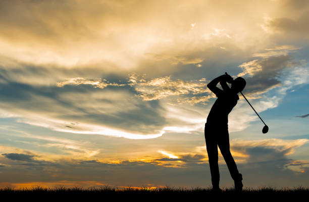 istock silhouette golfer playing golf during beautiful sunset 856794858