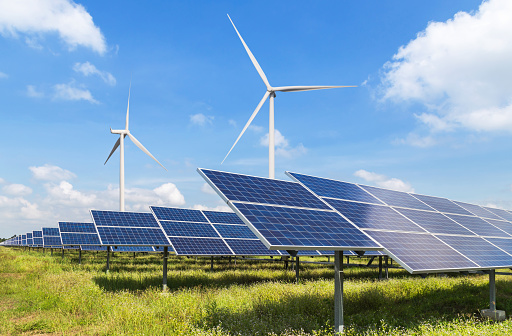 solar panels and wind turbines in power station