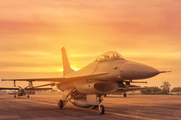 istock fighter jet military parked in the runway airforce on sunset 856800532