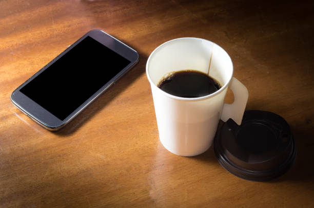 istock Paper cup coffee with mobile phone. 856801218