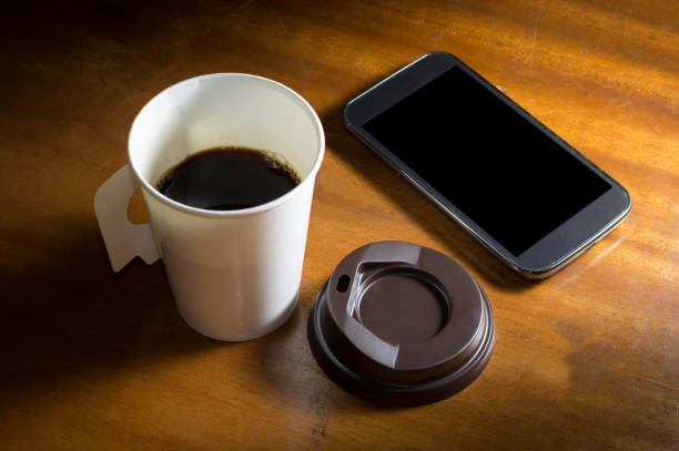 istock Paper cup coffee with mobile phone. 856801240
