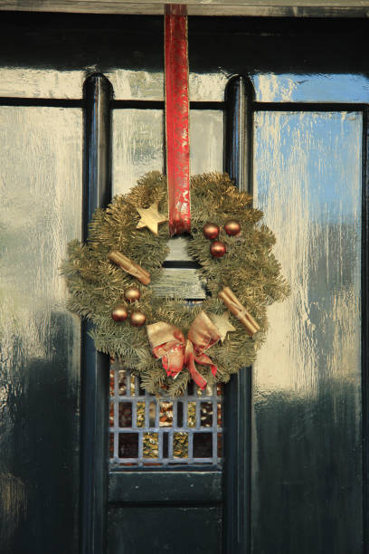 istock Classic christmas wreath with decorations on a door 856801778