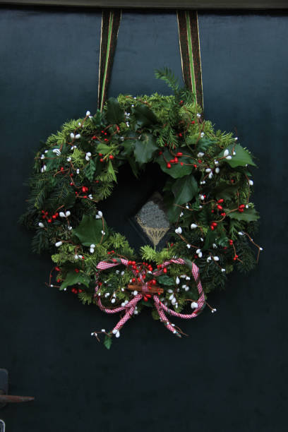 istock Classic christmas wreath with decorations on a door 856803884