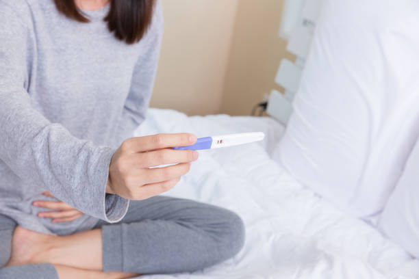 istock Young woman with the pregnancy test. 856804074