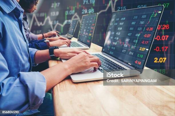 Business Team Investment Entrepreneur Trading Working On Laptop Stock Market Exchange Information And Trading Graph Stock Photo - Download Image Now