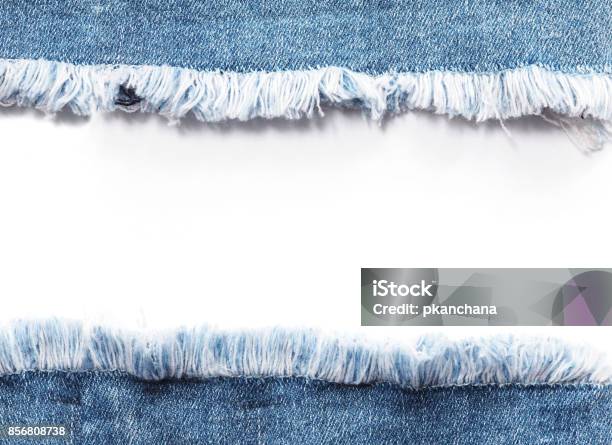 Edge Frame Of Blue Denim Jeans Ripped Destroyed Torn Over White Background Stock Photo - Download Image Now