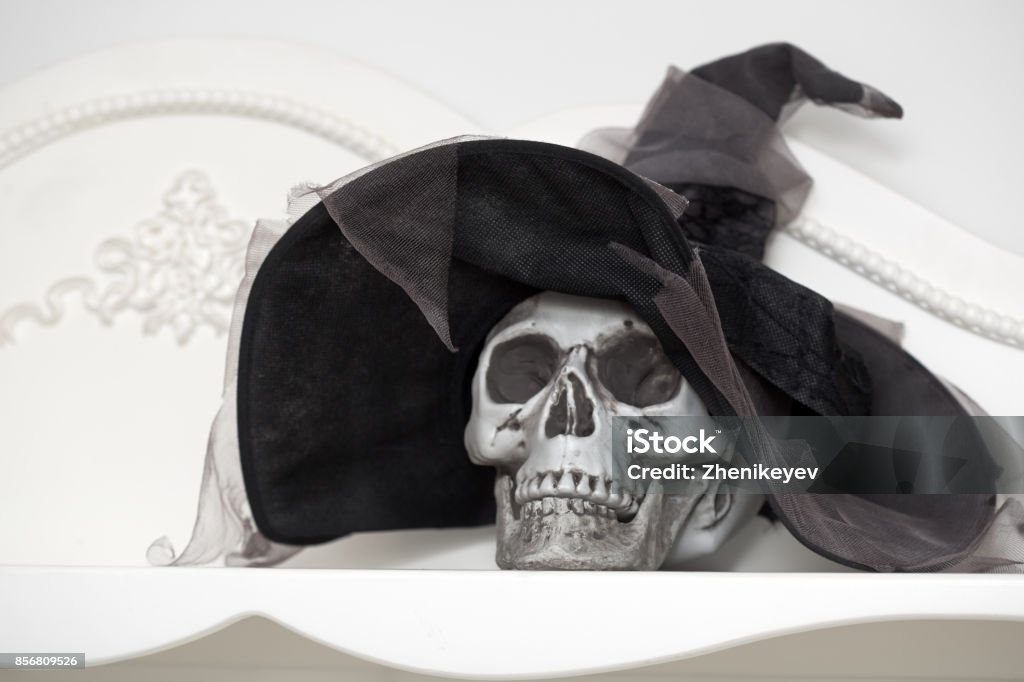 Halloween Human skull in a white cabinet. Halloween theme Cabinet Stock Photo