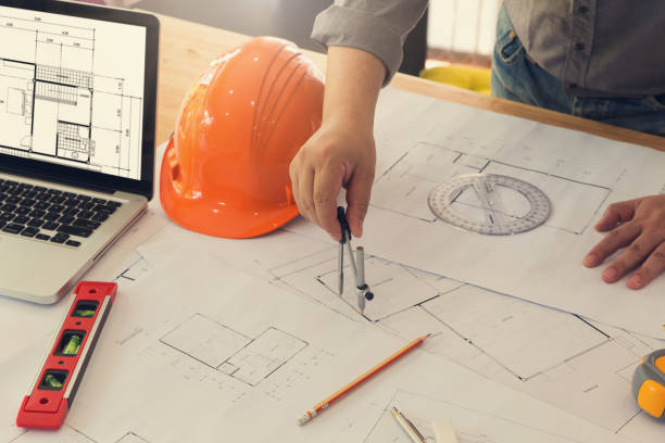 istock Architect concept, Architects working with blueprints in the office, Vintage Effect 856811800