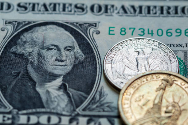 istock US dollar cash banknote and coin background close up 856811852