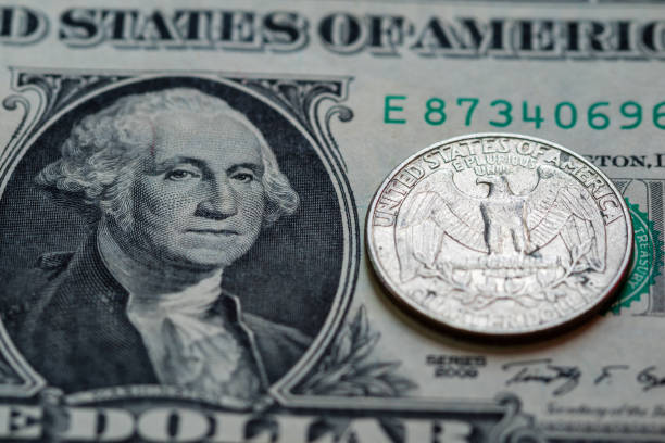 istock US dollar cash banknote and coin background close up 856811894