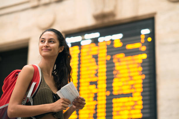 istock Beautiful woman at the train station. 856812884