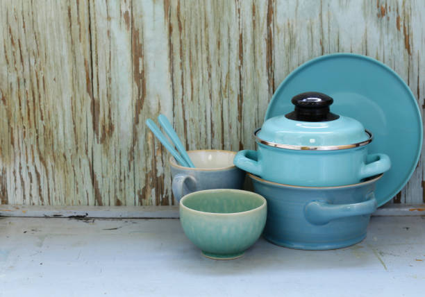 istock kitchen utensils, cooking pans on a wooden background, rustic style 856819796