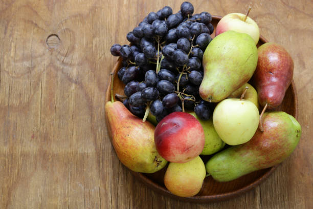 istock harvest still life, fruit on a wooden table 856819812