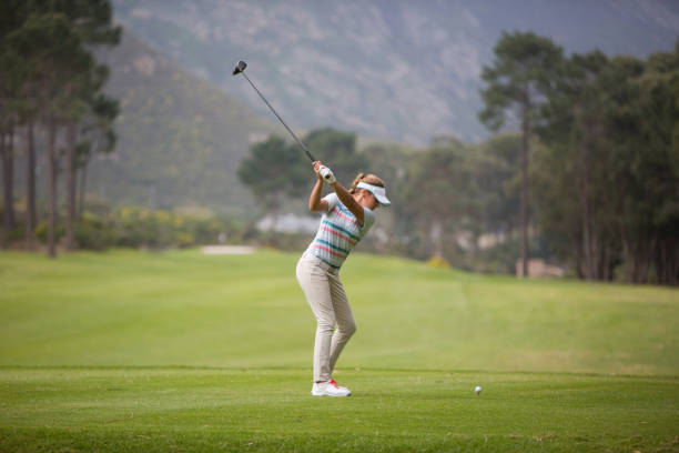 istock Blond woman hitting the golf ball 856819894
