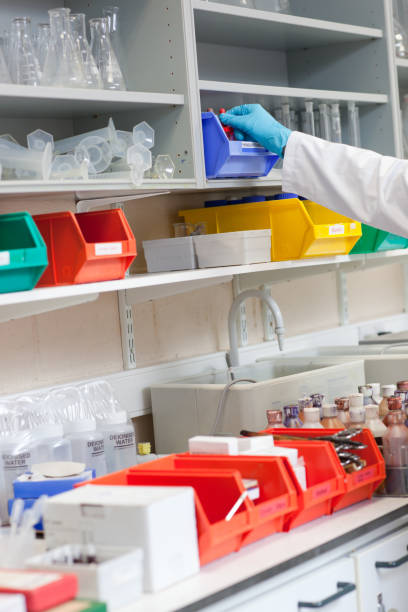 istock Close up of a scientist taking something on the shelf 856820768