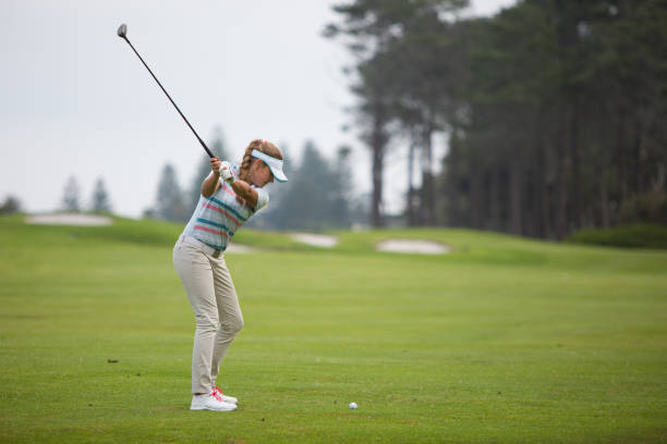 istock Woman hitting the golf ball 856831268
