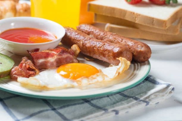 istock Nutritious breakfast, strawberry, bread, coffee orange juice, sausage, egg 856833876