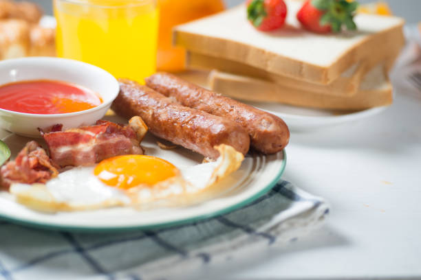 istock Nutritious breakfast, strawberry, bread, coffee orange juice, sausage, egg 856834100