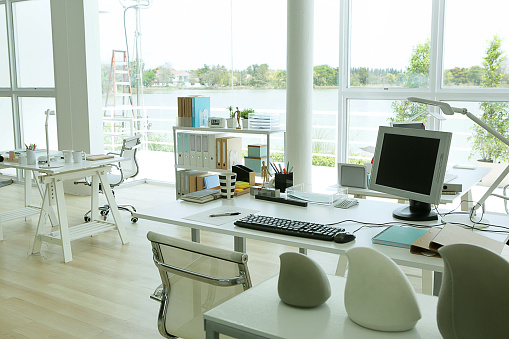 the modern office desk have a good view near by the lake