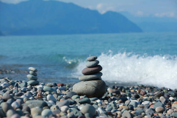 istock pyramid of pebbles on a sea beach 856834964