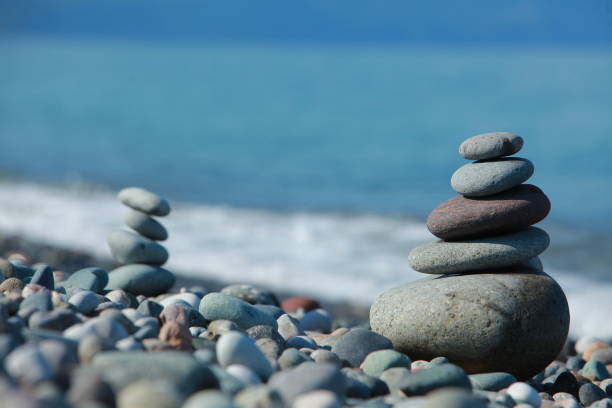 istock pyramid of pebbles on a sea beach 856835128