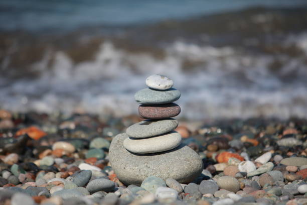 istock pyramid of pebbles on a sea beach 856835300