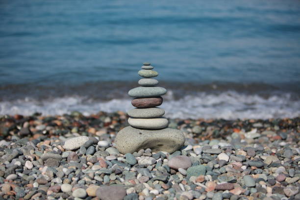 istock pyramid of pebbles on a sea beach 856837934