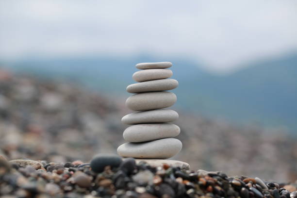 istock pyramid of pebbles on a sea beach 856839192