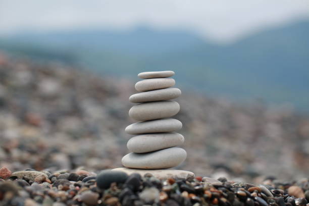istock pyramid of pebbles on a sea beach 856839218