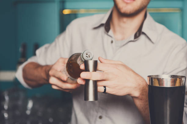 istock Bartender pouring syrup into measuring glass 856846022