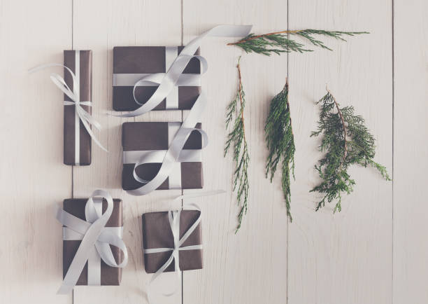 istock Top view of christmas present boxes on white wood 856847416