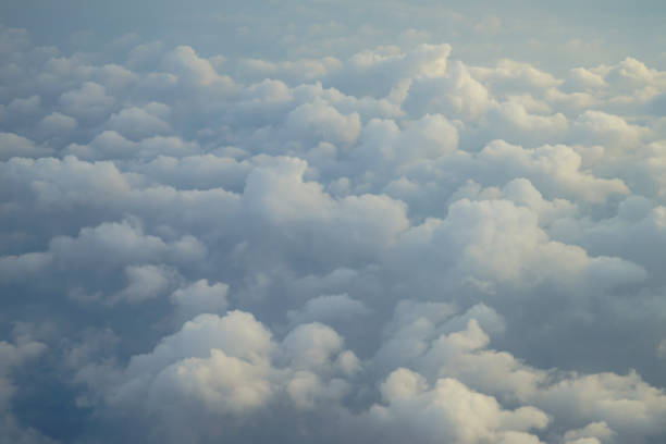 istock View of beautiful dreamy fluffy abstract white cloud with  sunrise light from airplane window 856849678