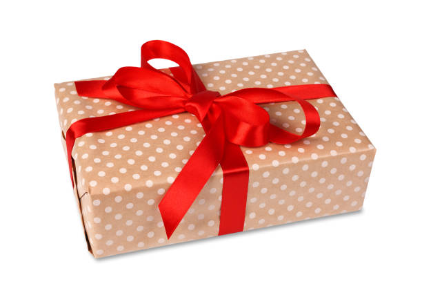 istock Christmas holiday gift box in spotted paper isolated on white 856849888