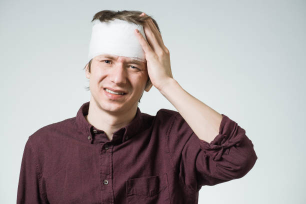 istock Ill man with bandage on his head 856849892
