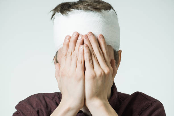 istock Ill man with bandage on his head 856849900