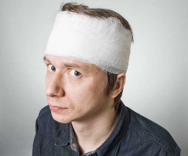 istock Poor ill man with bandage on his head 856849986