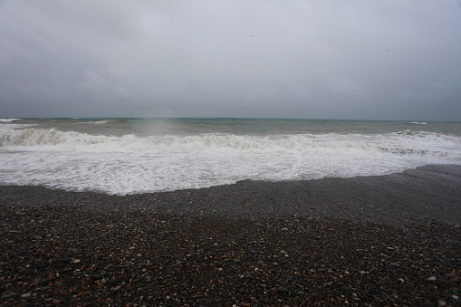 storm waves and rain on the sea beach black sea