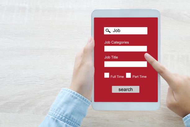 istock Hand using tablet searching job online on screen device, business and technology concept 856851438