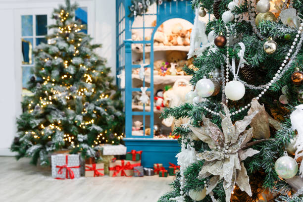 istock Christmas is coming. Decorated fir trees and presents background 856857510
