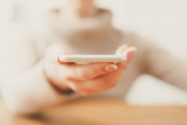 istock Woman holding smartphone, close up, selective focus 856858376