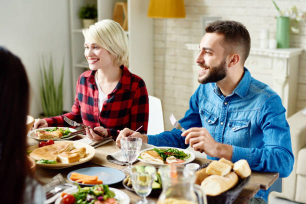 istock Group of Friends Enjoying Dinner 856858666