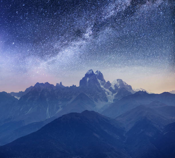 istock Fantastic starry sky. Snow-capped peaks. Main Caucasian Ridge. Mountain View from Mount Ushba Meyer, Georgia. Europe 856862782