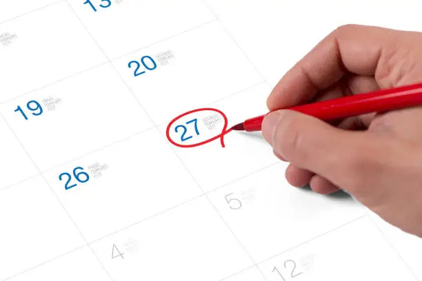Photo of Red circle. Mark on the calendar at February 27, 2016